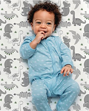 Baby on Dinosaur Crib Sheet